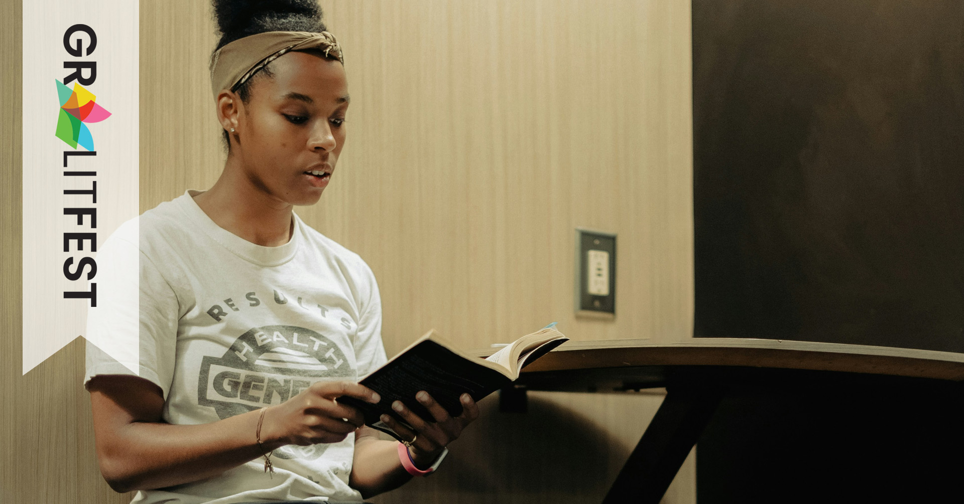young woman reading from book
