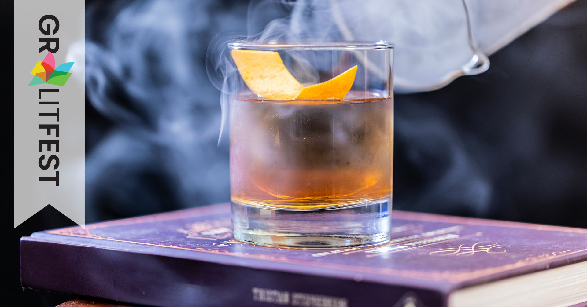 Cocktail tumbler on book