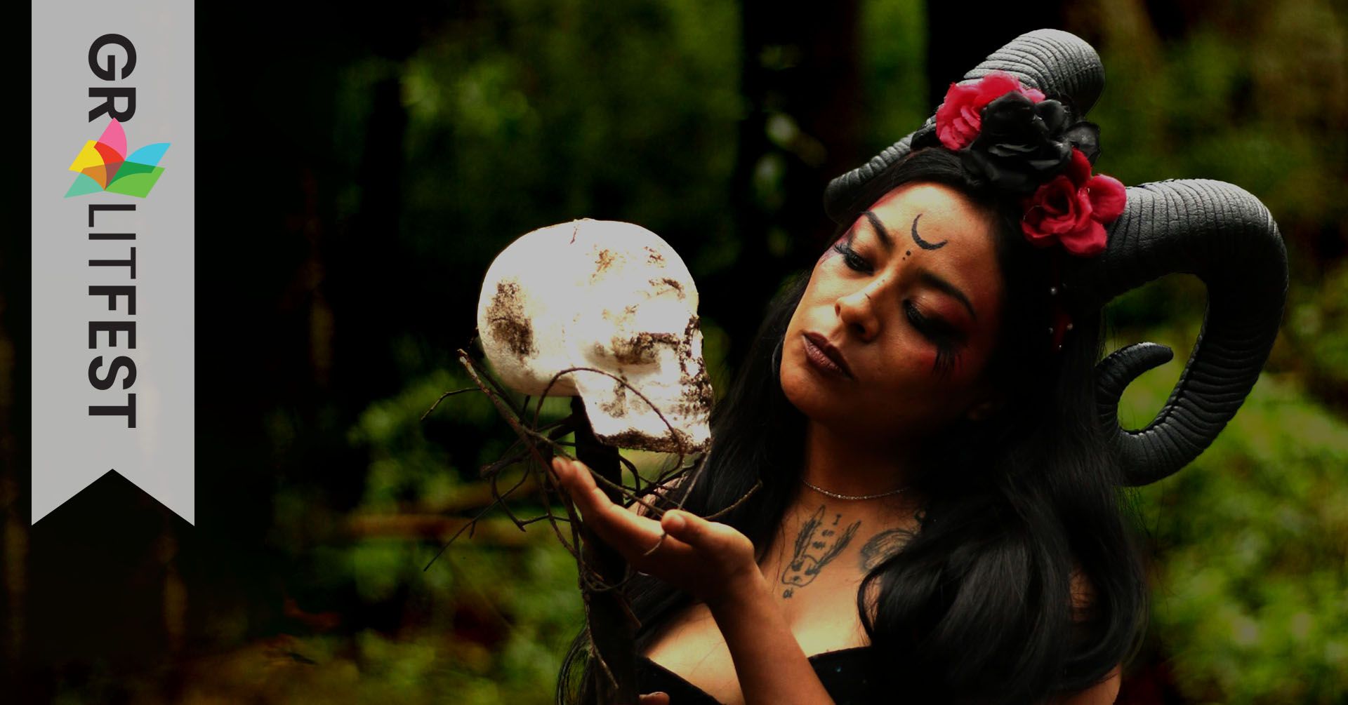 GR LitFest Logo and woman wearing horns and holding skull
